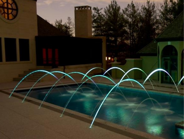 A beautifully lit pool with water jets